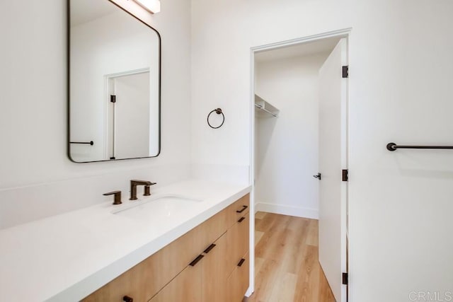 bathroom featuring vanity and hardwood / wood-style floors