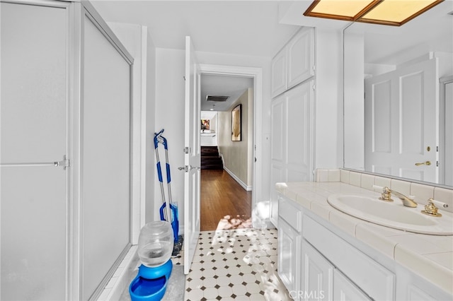 bathroom with wood-type flooring and vanity