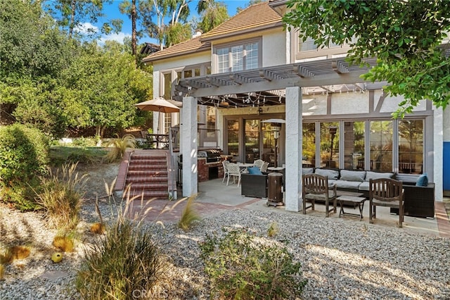 rear view of property featuring an outdoor living space, a pergola, and a patio