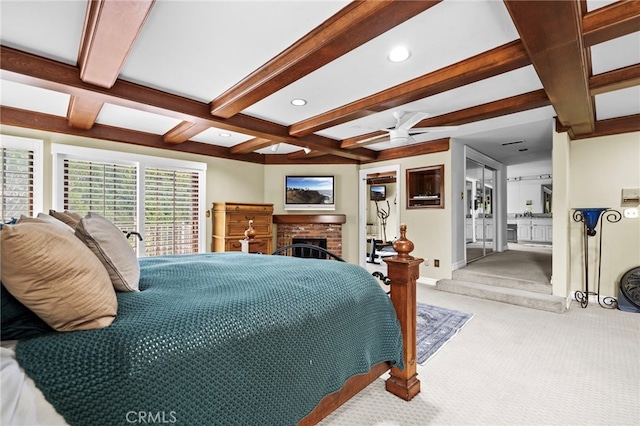 bedroom with ceiling fan, beam ceiling, a brick fireplace, coffered ceiling, and light carpet