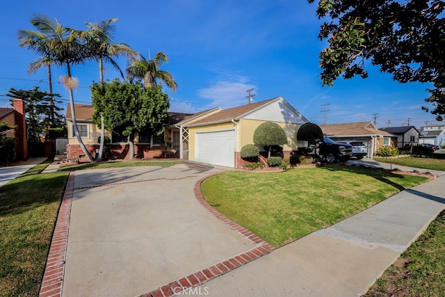 view of front of home featuring a front lawn and a garage