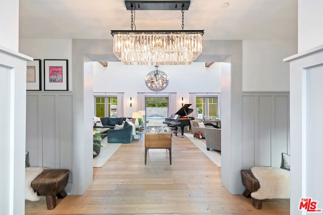 dining room with an inviting chandelier and light hardwood / wood-style flooring