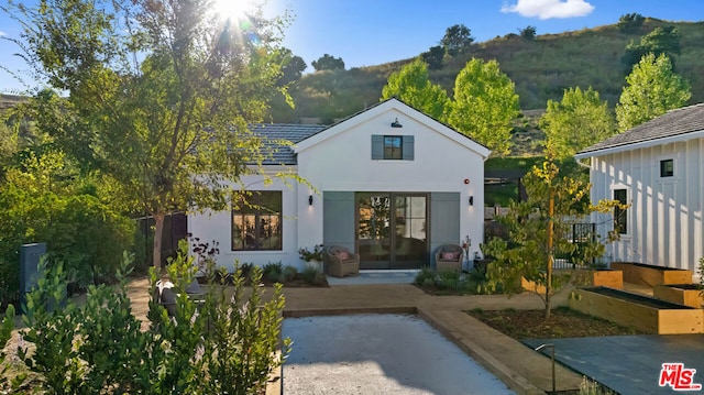 back of property featuring a mountain view