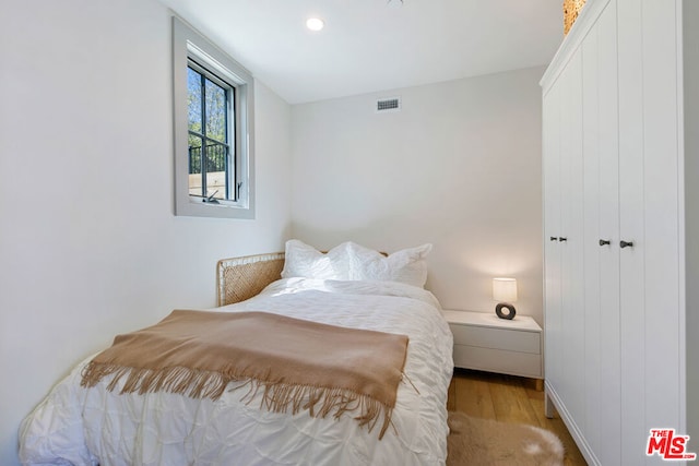 bedroom with light wood-type flooring