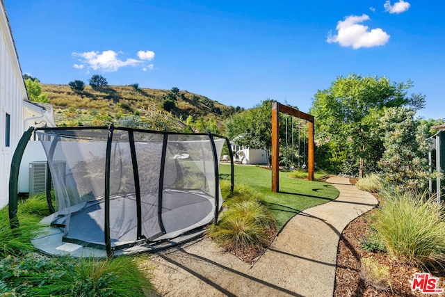 view of yard featuring a trampoline