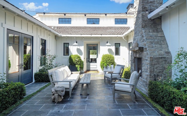 view of patio / terrace featuring an outdoor living space with a fireplace