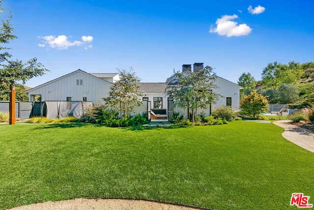 view of front of home with a front lawn