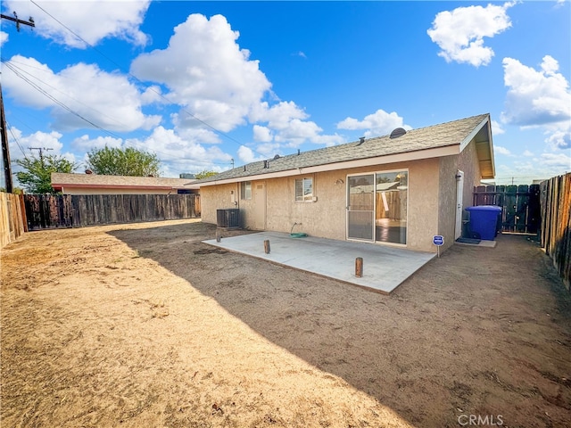 rear view of house featuring a patio and central air condition unit