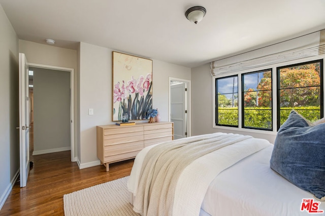 bedroom featuring dark hardwood / wood-style floors