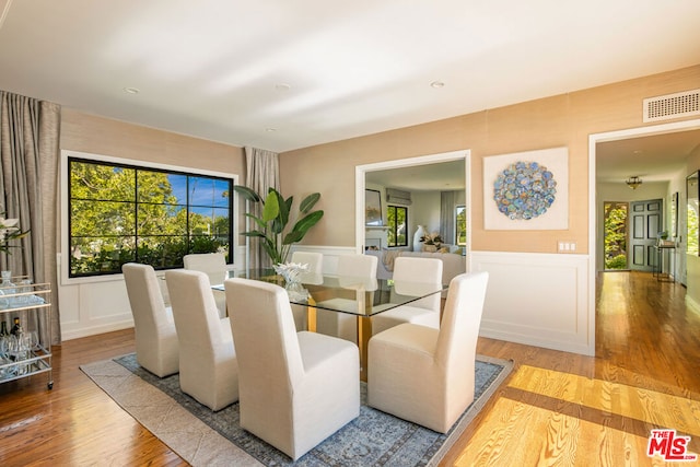 dining room with hardwood / wood-style floors