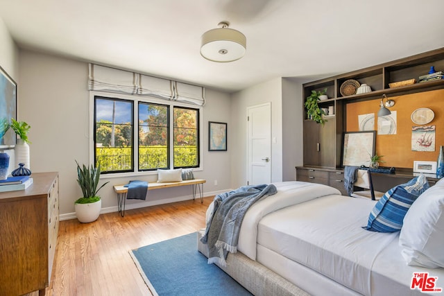 bedroom with light hardwood / wood-style floors