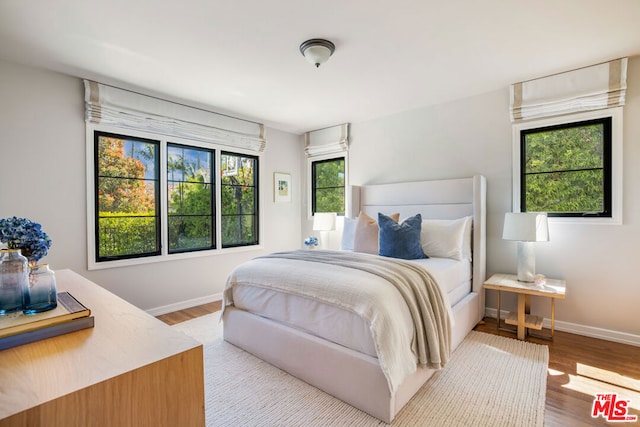 bedroom featuring light wood-type flooring