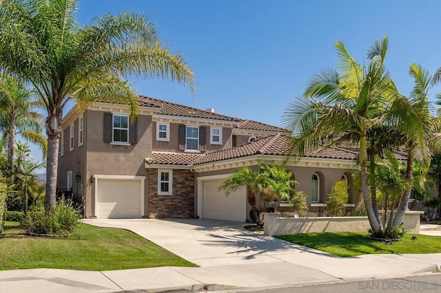 mediterranean / spanish-style house with a garage