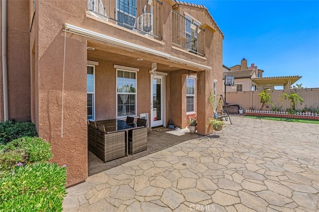 view of patio / terrace with a balcony