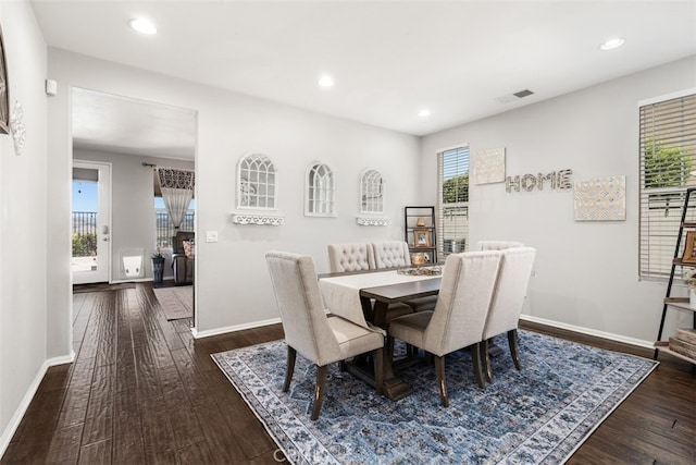 dining area with dark hardwood / wood-style floors