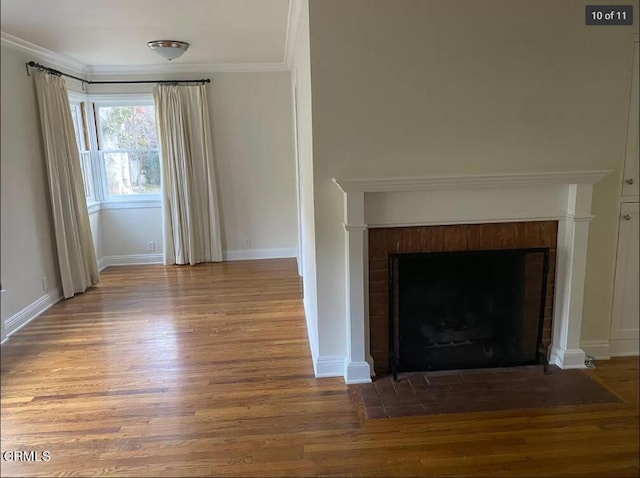 interior details featuring ornamental molding and hardwood / wood-style flooring