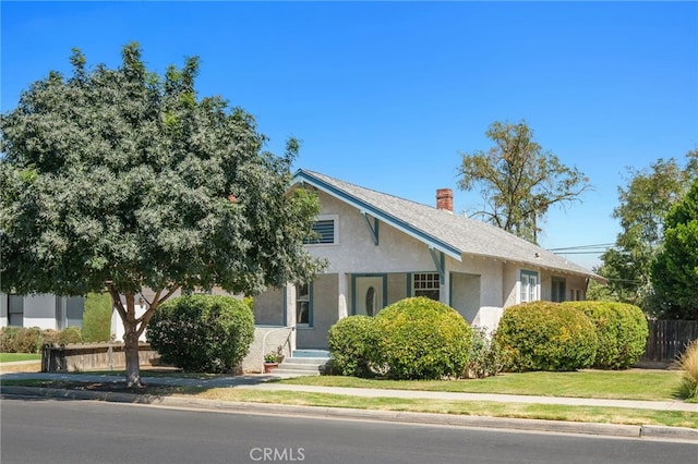 view of front of home with a front lawn