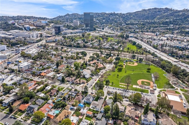 birds eye view of property with a mountain view