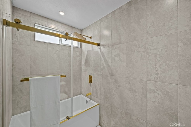 full bathroom with shower / bath combination with glass door
