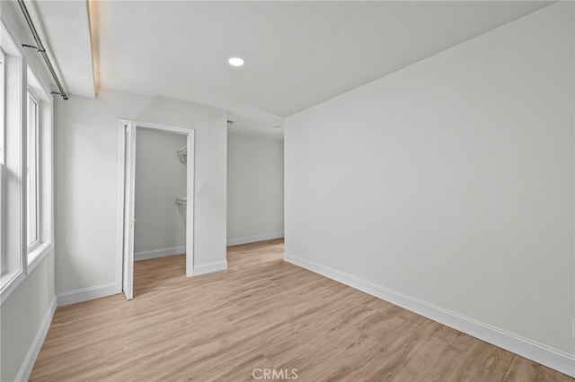 unfurnished bedroom featuring light wood-type flooring