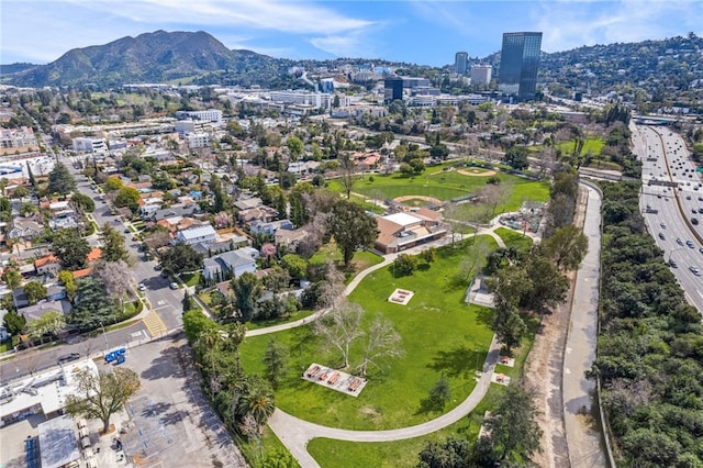 birds eye view of property featuring a view of city and a mountain view