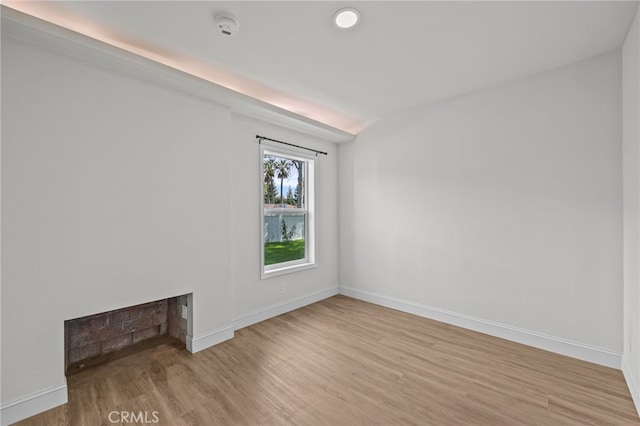 spare room featuring light hardwood / wood-style floors