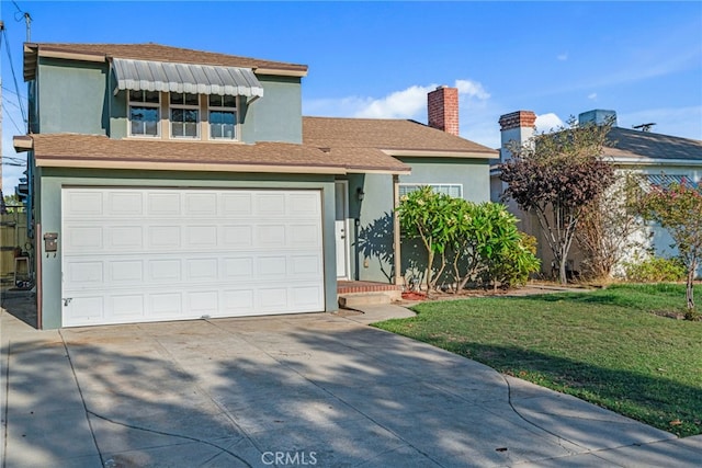 view of front of property featuring a front yard and a garage