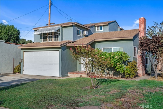 view of front of property featuring a front lawn and a garage