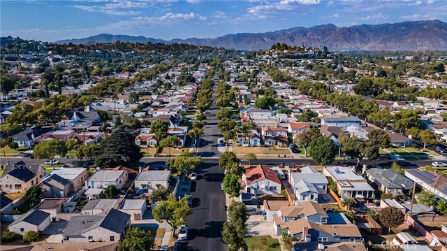 birds eye view of property with a mountain view