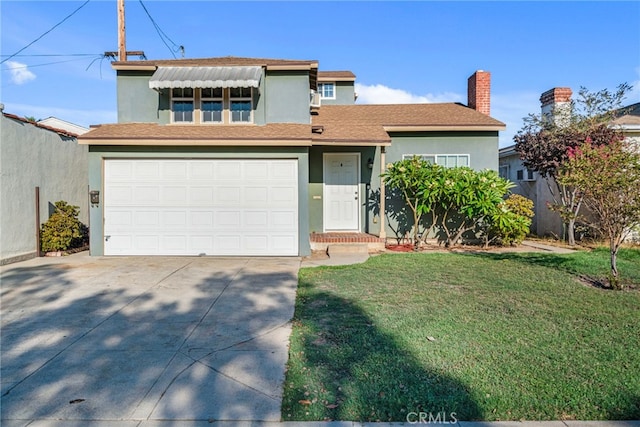 view of front of house with a garage and a front yard