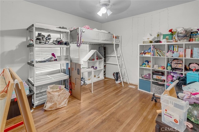 bedroom with ceiling fan and hardwood / wood-style floors