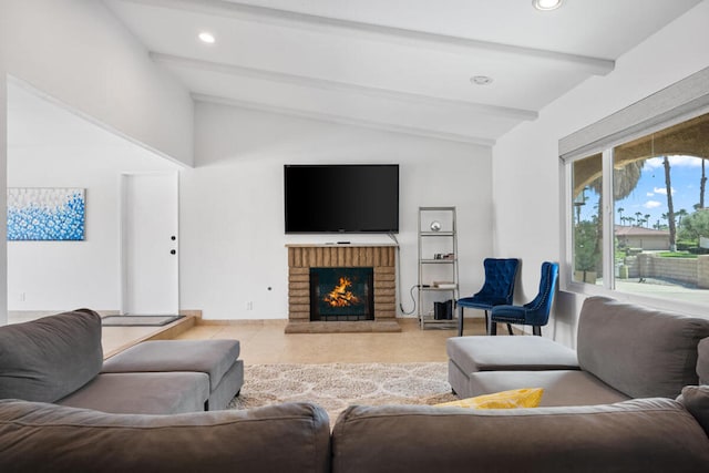 living room featuring a fireplace, lofted ceiling with beams, and light tile patterned floors