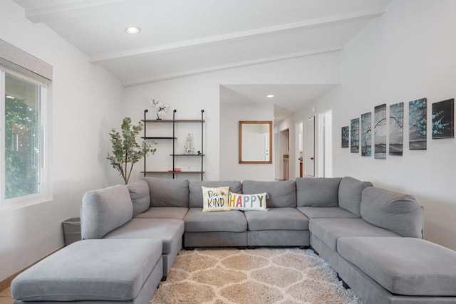 living room featuring vaulted ceiling with beams