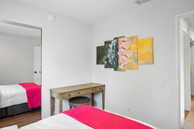 bedroom featuring wood-type flooring