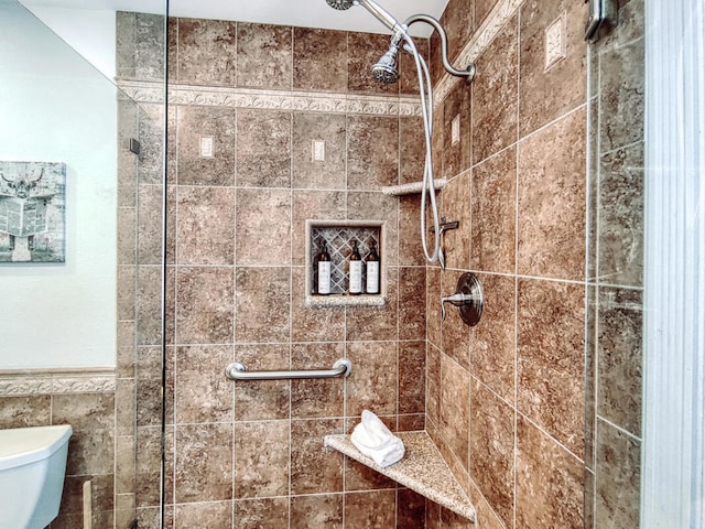 bathroom featuring tile walls, toilet, and an enclosed shower