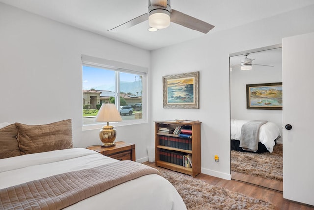 bedroom featuring a closet, ceiling fan, and hardwood / wood-style floors