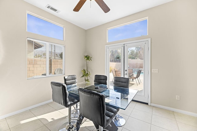 tiled office with ceiling fan and french doors