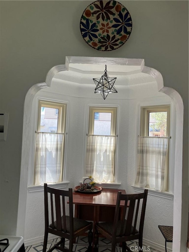 dining area featuring an inviting chandelier