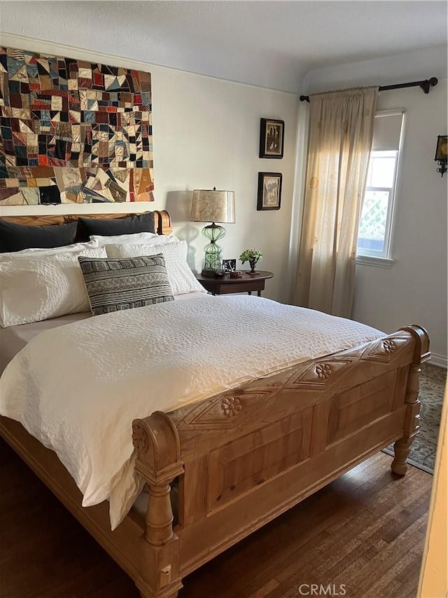 bedroom featuring dark hardwood / wood-style floors