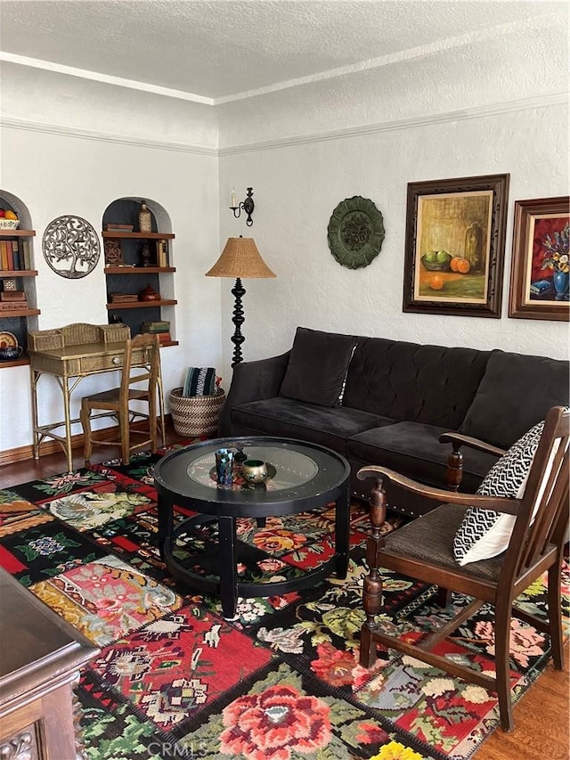 living room featuring a textured ceiling and hardwood / wood-style flooring