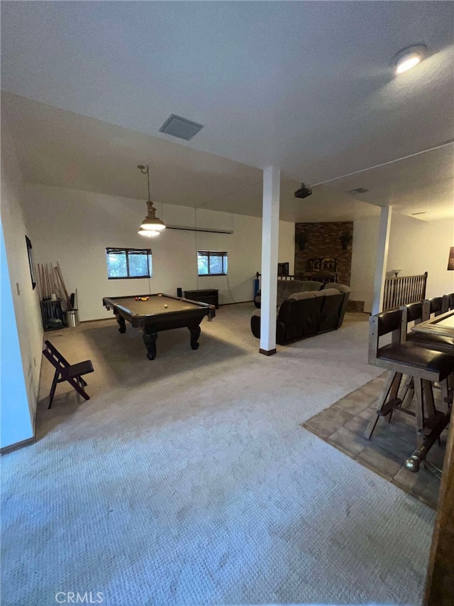 game room with carpet, a brick fireplace, and pool table