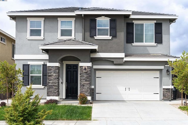 prairie-style house featuring a garage