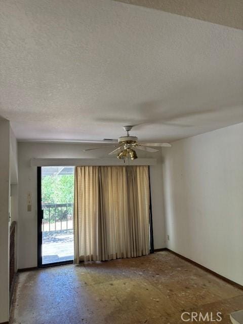 19189 Mountain Mdw N, Hidden Valley Lake, CA 95467 - spare room featuring a textured ceiling, baseboards, and a ceiling fan