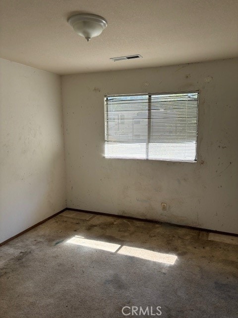 empty room featuring carpet flooring