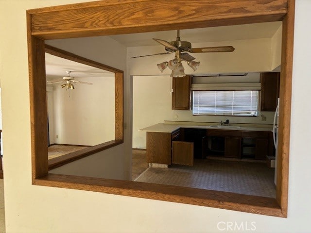 kitchen with ceiling fan and sink