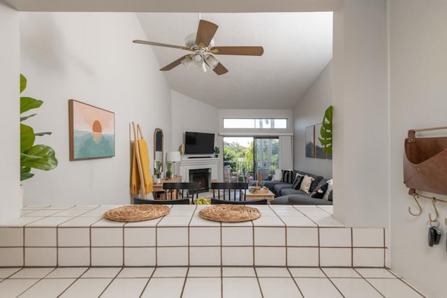 living room with high vaulted ceiling and ceiling fan