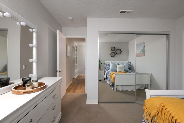 carpeted bedroom featuring a closet