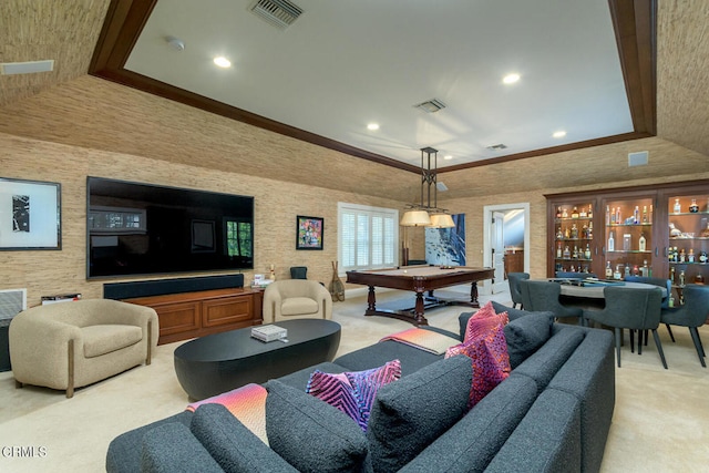 living room featuring light carpet, indoor bar, a tray ceiling, and billiards