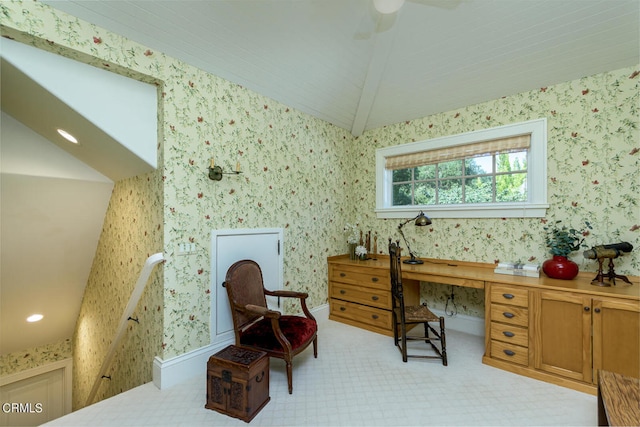 sitting room featuring lofted ceiling with beams