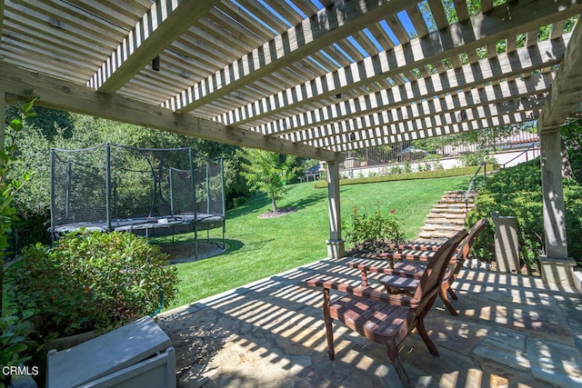 view of patio / terrace featuring a pergola and a trampoline